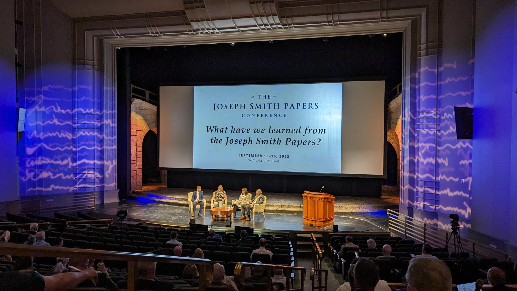 JSP staff onstage at the Joseph Smith Papers conference while audience
